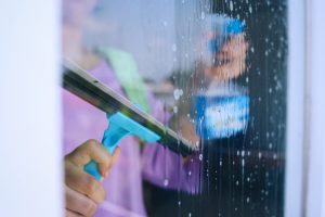 woman-cleaning-window-2025-03-15-19-37-52-utc